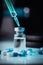 Vertical shot of pharmaceutical syringe with needle in a medicine and pills - illegal doping drugs