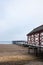 Vertical shot of the pier at the seaside town of Saltburn-by-the-Sea on a misty day, North Yorkshire