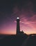 Vertical shot of the Pigeon Point Light Station with a beautiful sky in the background at sunset