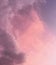 Vertical shot of a pinkish cloudy sky, perfect for backgrounds and wallpapers