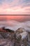 Vertical shot of the pinky Pacific ocean at dreamy sunset