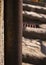 Vertical shot of a pipe going up on the old building exterior wall