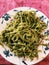 Vertical shot of a plate of Spinach pasta