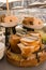 Vertical shot of a platter of sliced bread and bagels at a dinner buffet