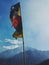 Vertical shot of prayer flags and hills on a sunny day