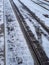 Vertical shot of a railway covered with snow during winter