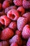 Vertical shot of raspberries. Pink raspberries. Macro. Close up