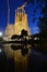 Vertical shot of the reflection of Sagrada Familia in the water captured in Barcelona, Spain