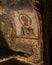 Vertical shot of a religious painting in Catacombs of San Gennaro, Rione Sanita, Naples, Italy