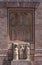 Vertical shot of religious sculptures on the wall of a cathedral