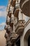 Vertical shot of a residential building with classic designed balconies