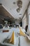 Vertical shot of restaurant tables and chairs with glassware and napkins