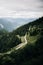 Vertical shot of road passing through the forests of the Alps in Bavaria, Germany