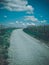 Vertical shot of a road surrounded by beautiful vineyards