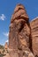Vertical shot of a rock formation at the Arches National Park with blue cloudy sky in Utah - USA