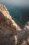 Vertical shot of rocky cliffs over the water near Pissouri trail, Cape Aspro, Pissouri, Cyprus
