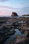 Vertical shot of a rocky Pirates Bay in Guanacaste, Costa Rica at sunset