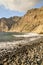 Vertical shot of a rocky seashore near a cliff in Tenerife, Los Gigantes