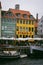 Vertical shot of the Sailboats against the buildings in the port of Nyhaven in Copenhagen, Denmark