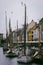 Vertical shot of the Sailboats against the buildings in the port of Nyhaven in Copenhagen, Denmark