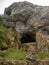 Vertical shot of the San Adrian cave opening at the Aizkorri mountain in Arantzazu, Spain