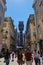 Vertical shot of the Santa Justa Lift within Lisbon Portugal with lots of tourist and locals walking