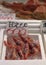 Vertical shot of several shrimps being sold in the market