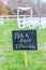 Vertical shot of signage, pick a seat either side on a wedding day with a blurred background