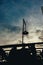 Vertical shot of a silhouette of a street lamp during the sunset