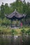 Vertical shot of small Chinese pagoda in Dongpo Urban Wetland Park near Minjiang river, Meishan city