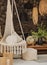 Vertical shot of a small hammock with pillows in a veranda