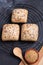 Vertical shot of small loaves of breads with sunflower, sesame and poppy seeds