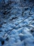 Vertical shot of snow textures in Maksimir, Zagreb, Croatia on a dark day