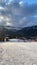 Vertical shot of snowy land under Mont Blanc Mountain under gloomy cloudy sky in France