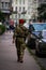 Vertical shot of a soldier walking on the street