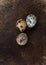 Vertical shot of speckled quail eggs on a brown surface