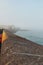 Vertical shot of St Ives harbor pavement with sea view in a mist