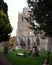 Vertical shot of St James Church with old tombstones in Hemingford Grey Cambridgeshire, England.