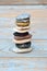 Vertical shot of a stack of flat stones on a wooden table