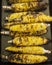 Vertical shot of a stack of grilled corns