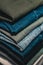 Vertical shot of a stack of neatly folded jeans