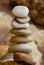 Vertical shot of a stack of rocks on a blurred background