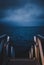 Vertical shot of a staircase leading to the ocean at Wellington Harbour, New Zealand