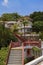 Vertical shot of stairs to a beautiful building among exotic nature