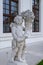 Vertical shot of a statue of a child in the Baroque Gardens by the Castle in Bratislava, Slovakia