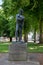 Vertical shot of the statue of the famous WW1 poet Rupert Brooke in a park in Rugby, United Kingdom