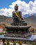 Vertical shot of a statue of The Holy Tibetan Buddha shrine of Muktinath Upper Mustang, Nepal