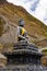 Vertical shot of a statue of The Holy Tibetan Buddha shrine of Muktinath Upper Mustang, Nepal