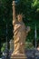 Vertical shot of The Statue of Liberty made from straw at a small town