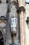 Vertical shot of a statue on the wall of the Gothic revival church of st. Nicolas in Hamburg